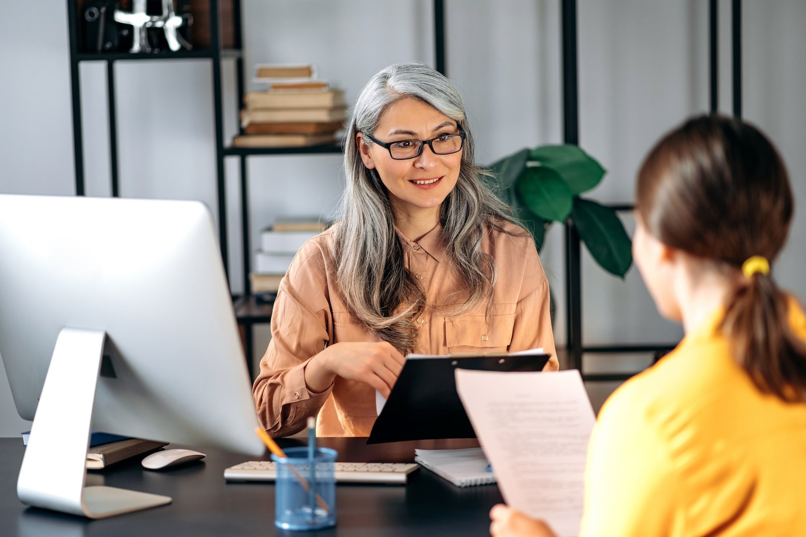 boss-asian-hr-manager-office-resume-smiling.jpg